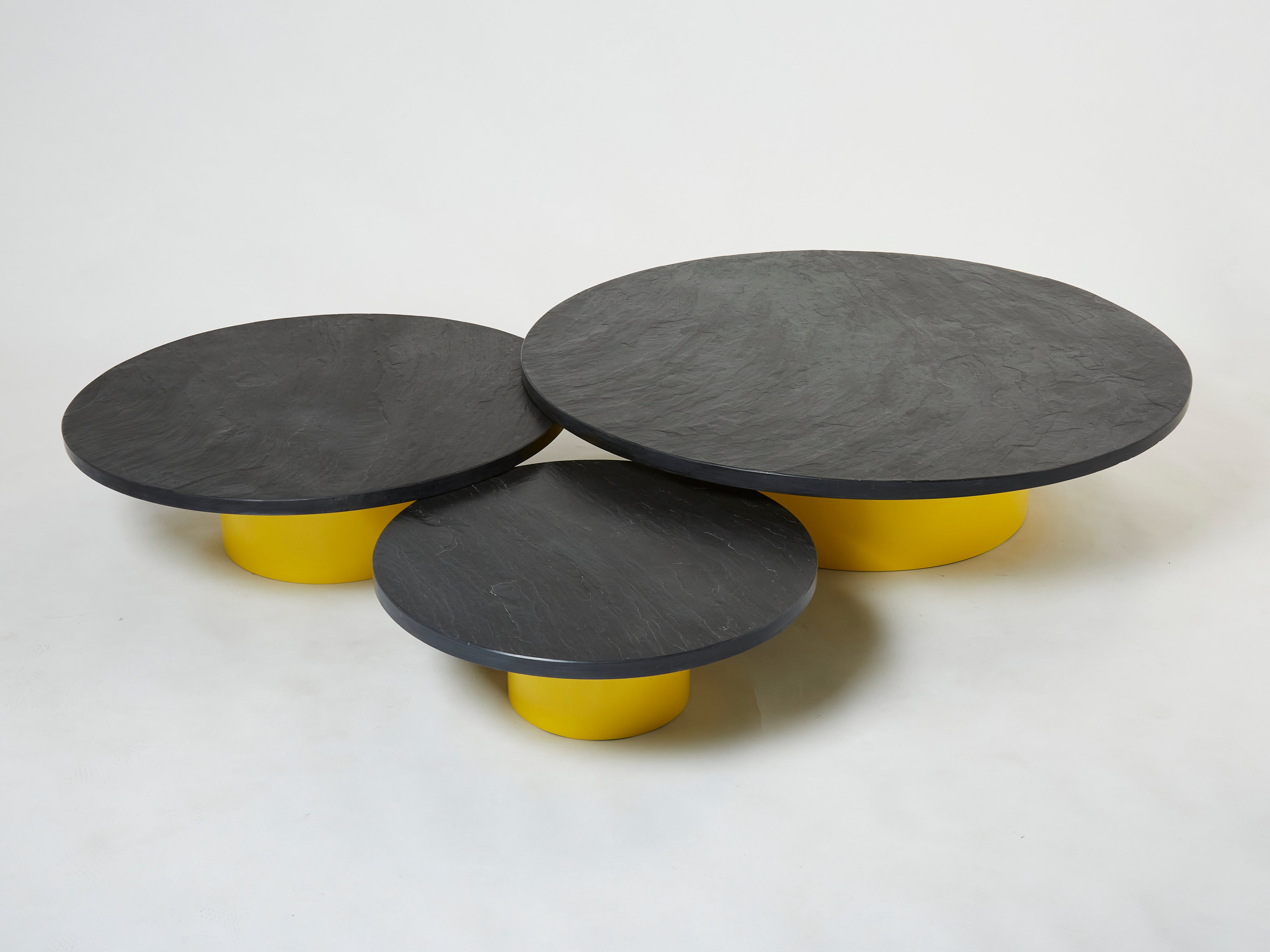 Set of three large round coffee tables yellow lacquer slate tops 1970s