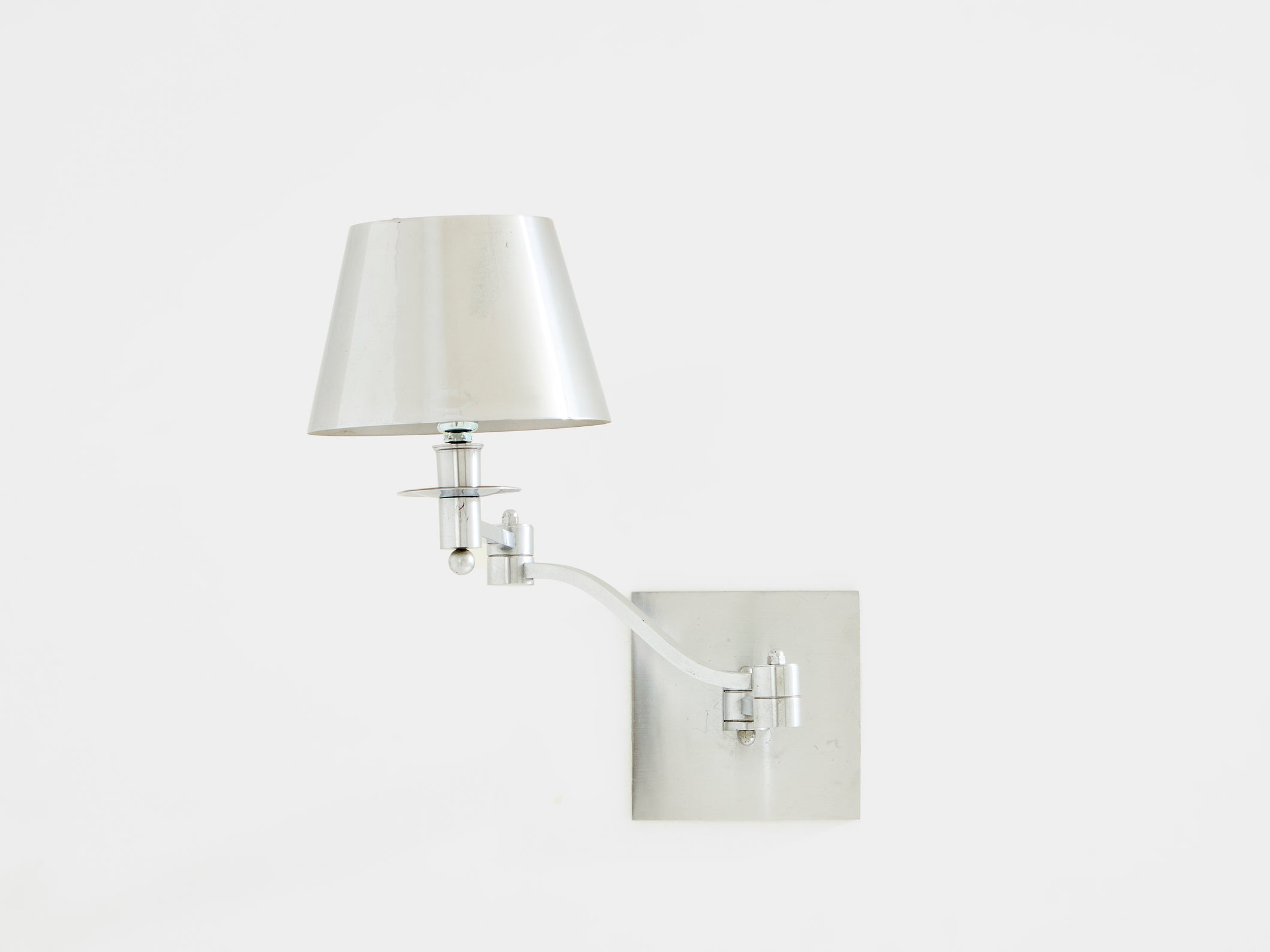 Maison Charles single brushed steel adjustable swing-arm sconce 1960s