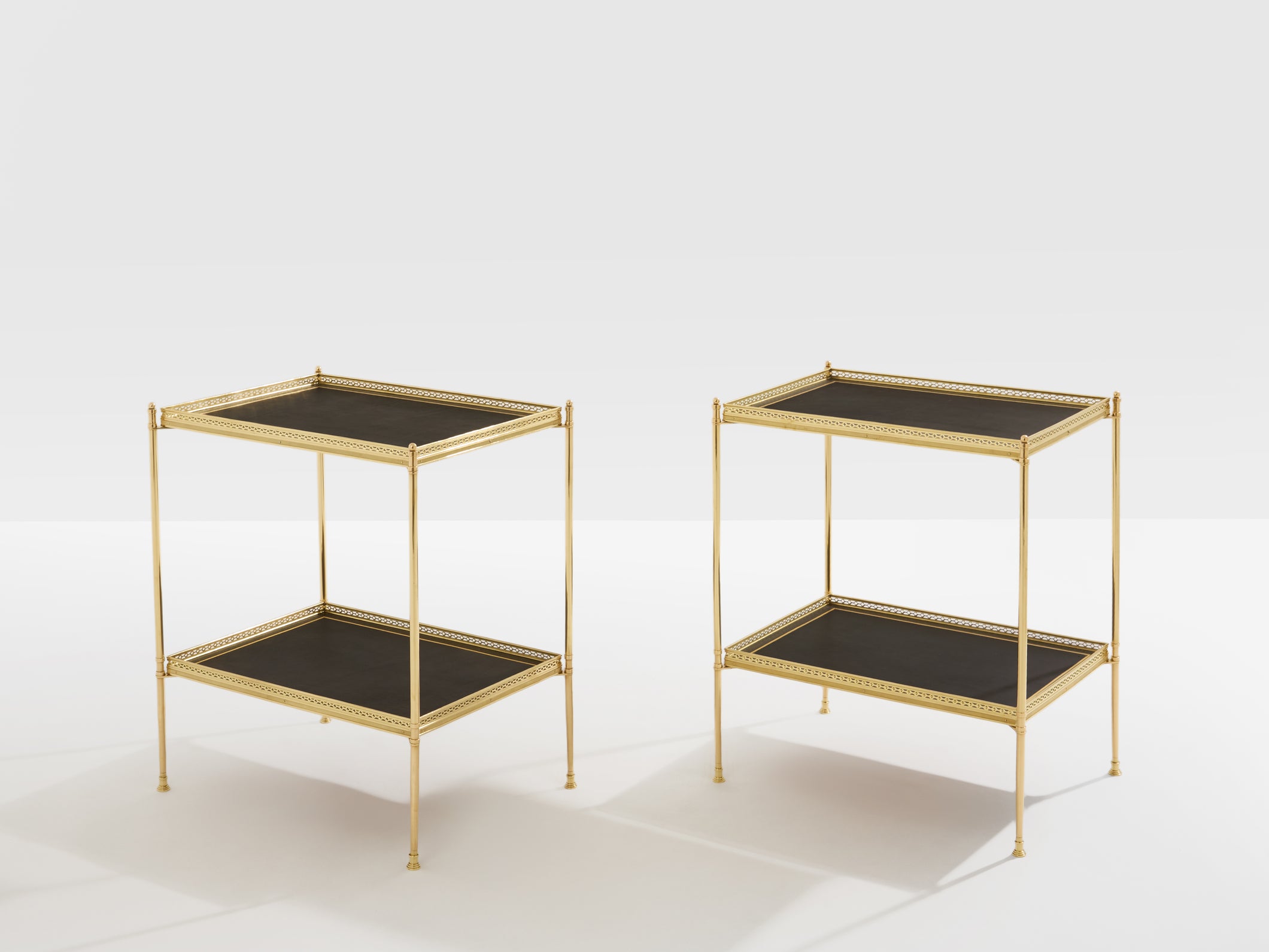 Maison Jansen pair of two-tier side tables brass black leather 1960s