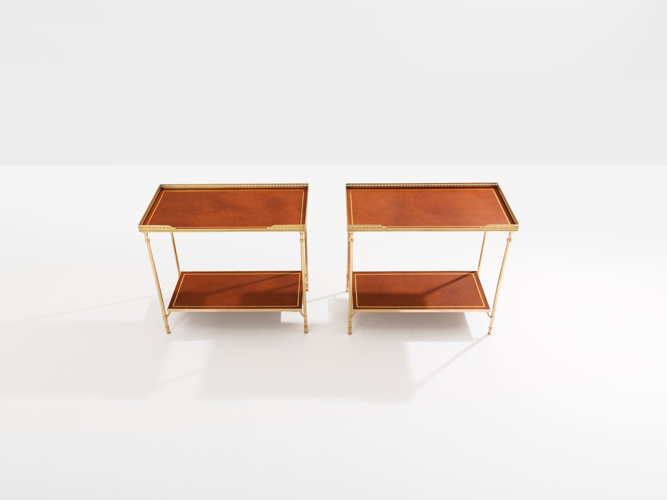 Maison Jansen pair of two-tier side tables brass brown leather 1960s