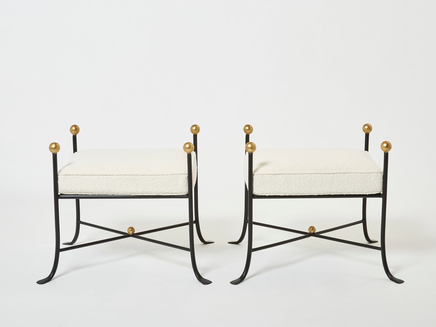 Pair of French 1950s wrought iron and gold leaf bouclé stools