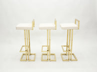Set of three French brass bouclé bar stools by Maison Jansen 1970s