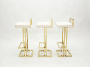 Set of three French brass bouclé bar stools by Maison Jansen 1970s