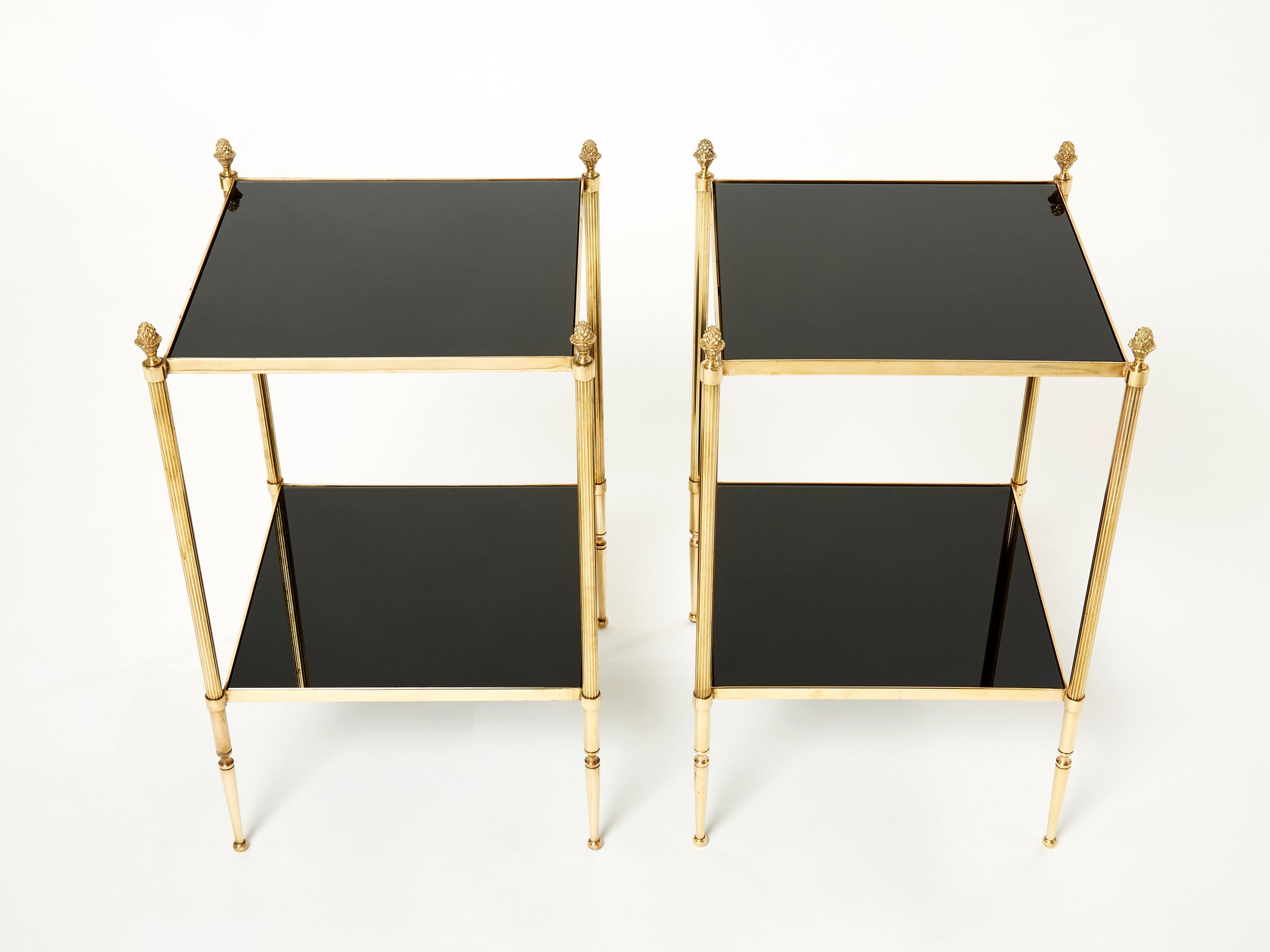Pair of French Maison Jansen brass black glass two-tier end tables 1960s