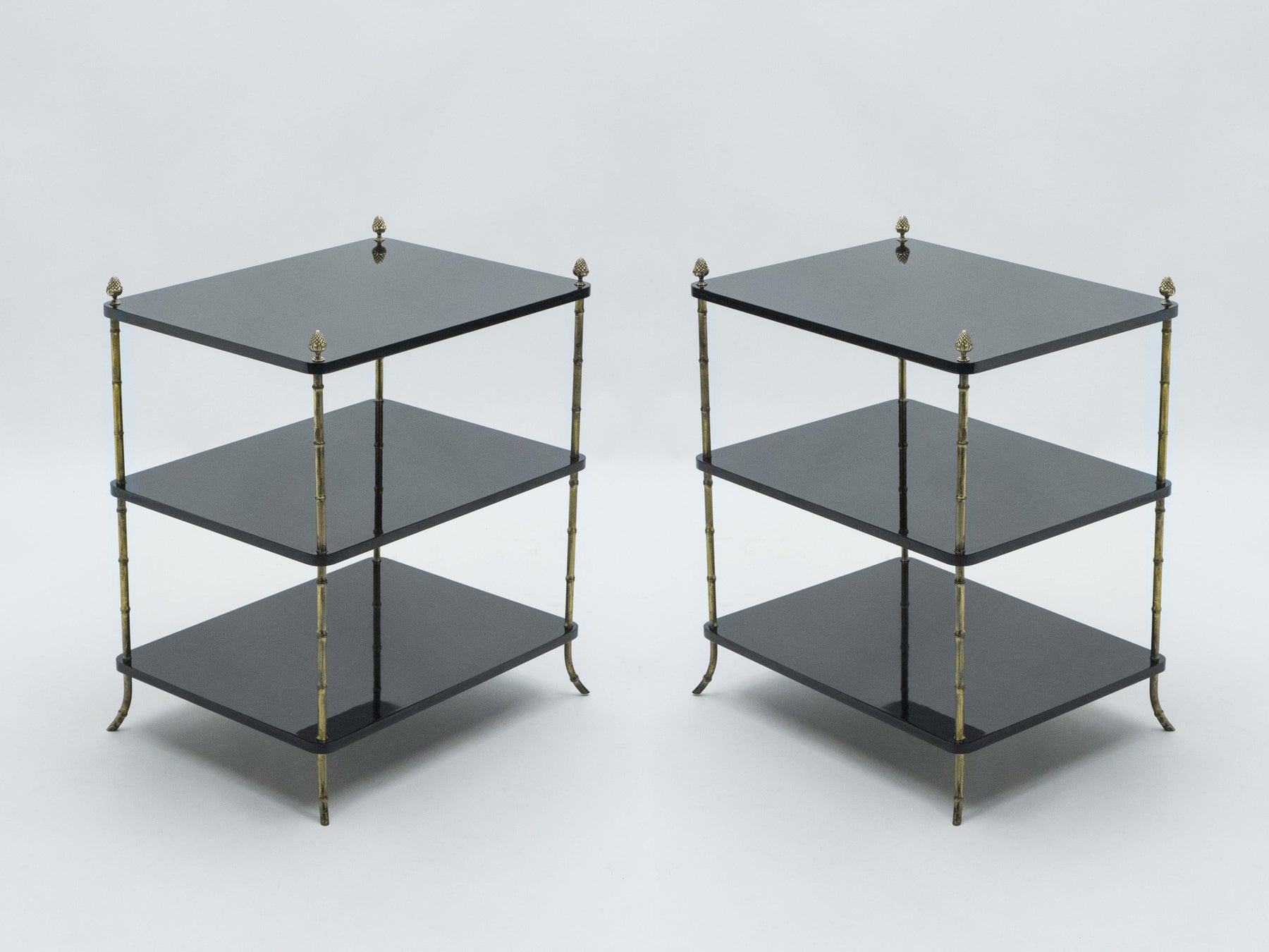 Pair of French Maison Baguès brass black lacquer three-tier side tables 1950s