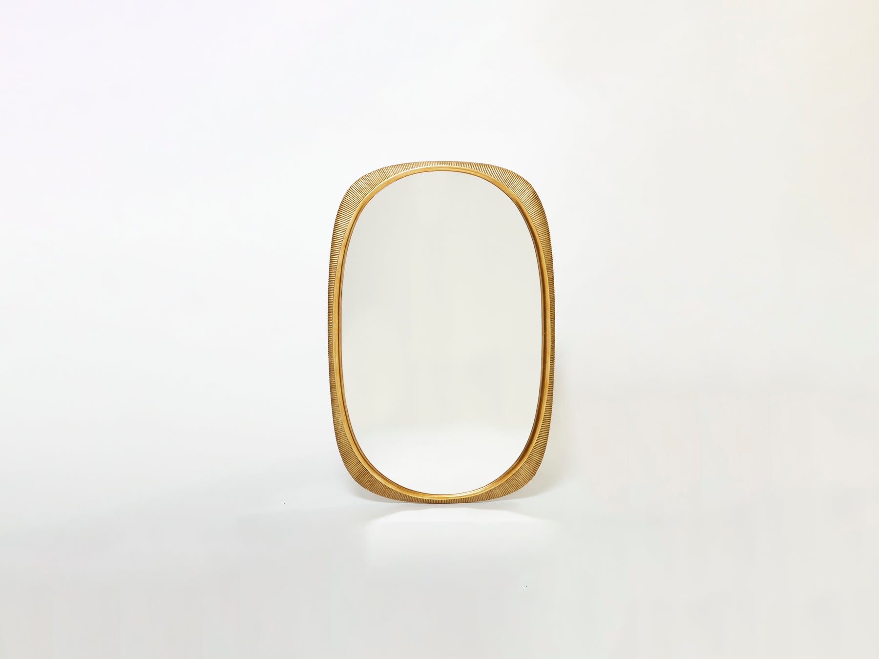 Osvaldo Borsani Large Italian curved gilded wood mirror 1954