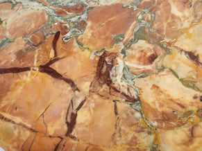 Table basse oeil en marbre sicilien vers 1980
