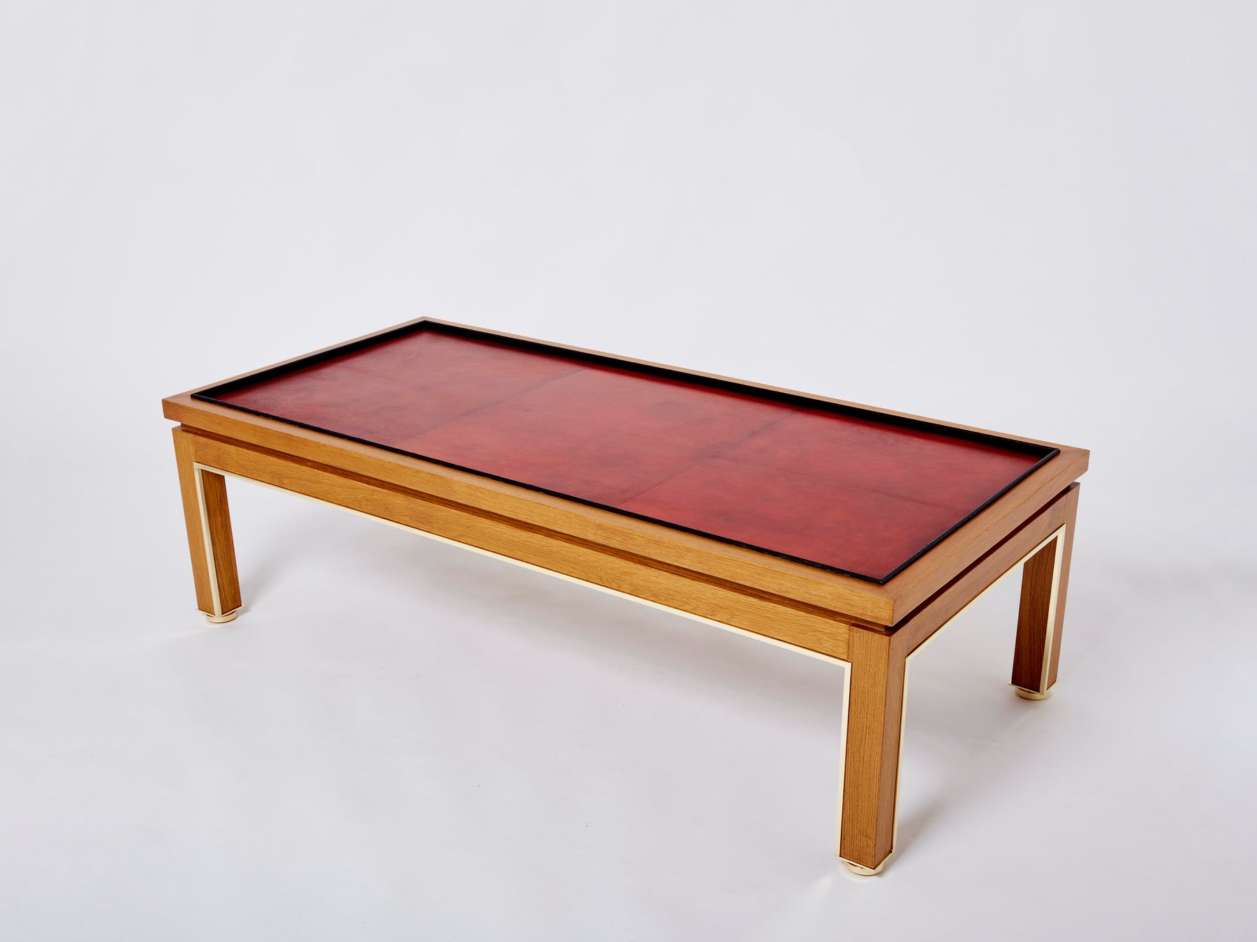 Table basse style Dupré-Lafon chêne laiton cuir par Alberto Pinto 1990